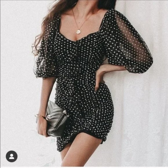 Zahra | Black & White Polka Dot Halter-Neck Ruched Mini Dress With Ruffle Hem main image 0